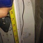 Measuring distance from the floor to install the brackets