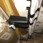 Screwing in the safety sensor. Notice it is the correct location.