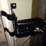 Screwing in the receiving safety sensor. Notice it is the correct location.